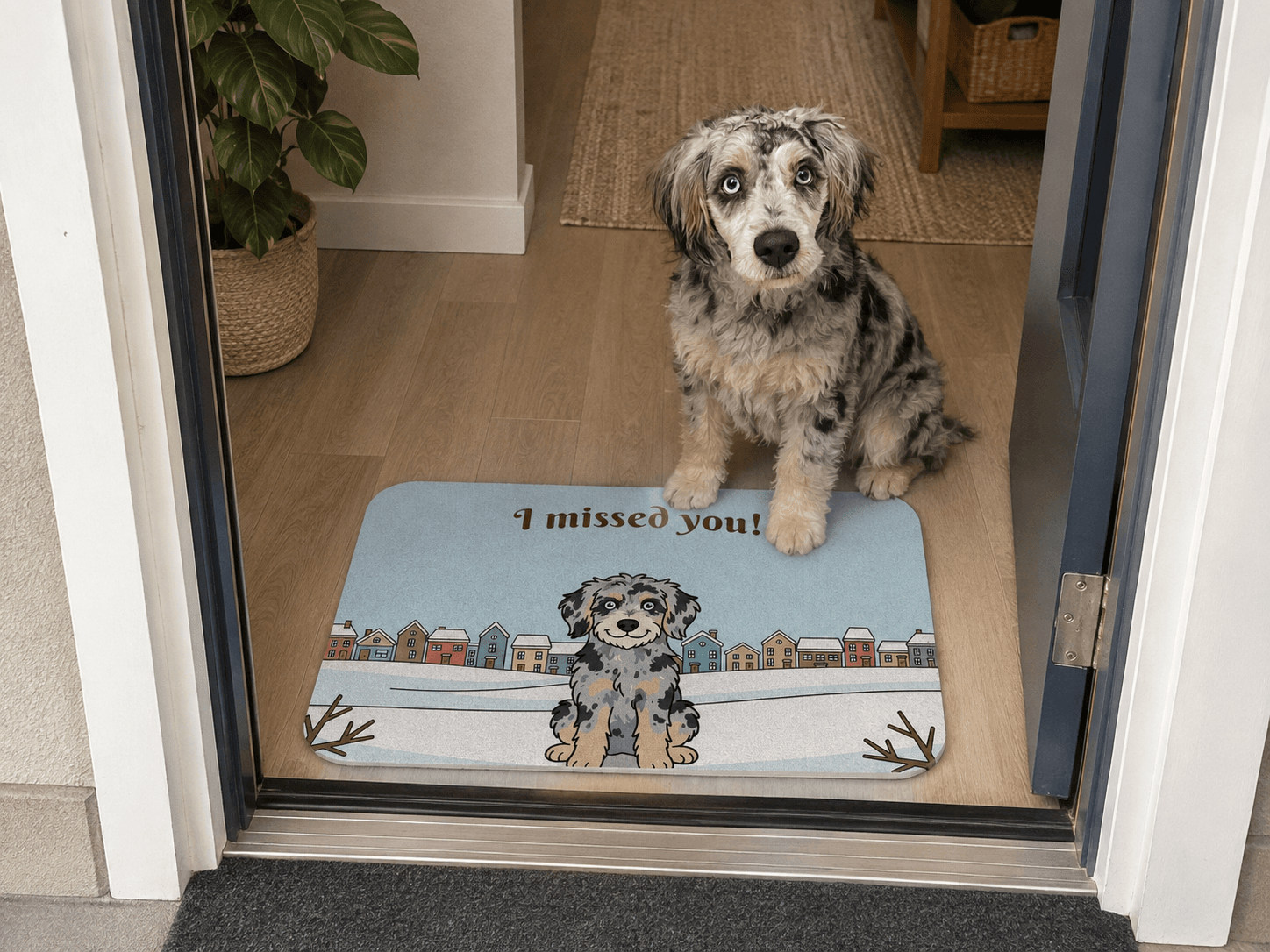 Paulie sitting behind a colorful indoor mat featuring his portrait in a winter scene